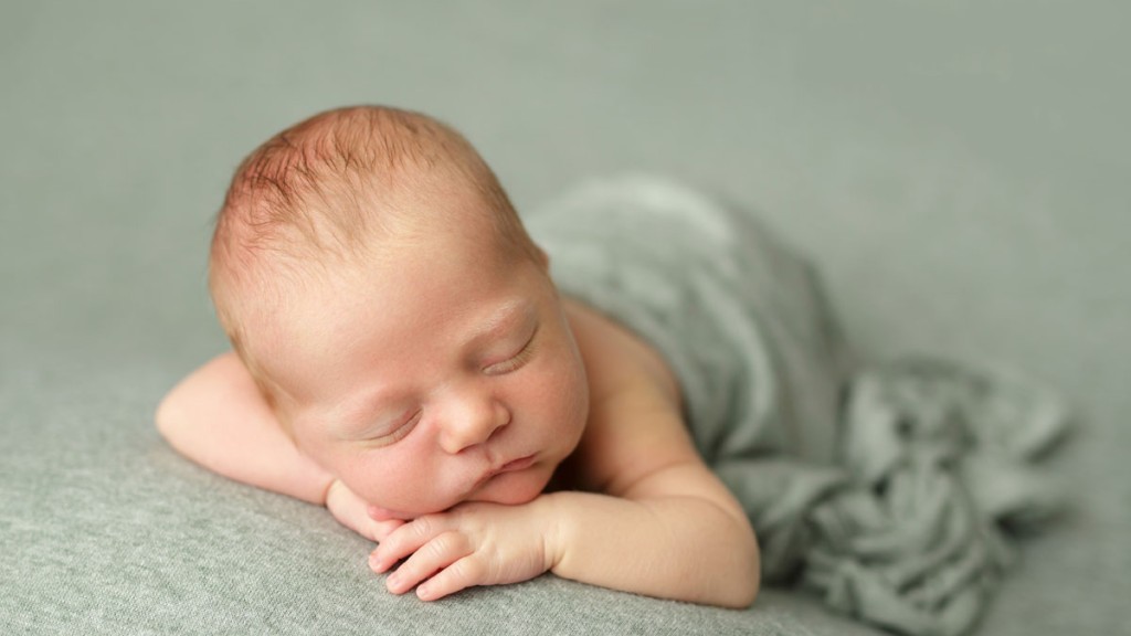 newborn baby posed facing forwarn in a San Diego newborn photography studio. Posed expertly and with safety first by Shelly Rosen who has a photography studio in San Marcos Ca.