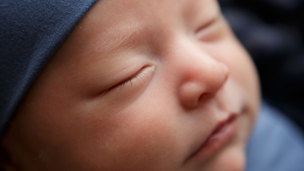 Macro baby photography image shows the tiniest details. Baby's eyelashes are featured in this image by San Diego newborn Photographer Shelly Rosen